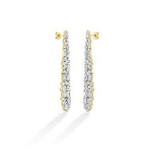 Round Lab-Grown Diamond Earrings in 18K yellow gold, worn on model