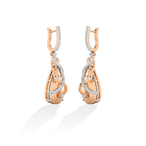 Round Lab-Grown Diamond Earrings in 18K rose gold, worn on model