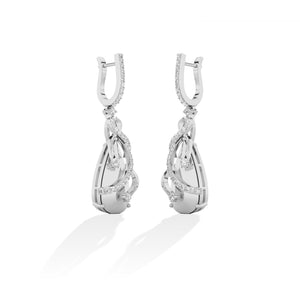 Round Lab-Grown Diamond Earrings in 18K white gold, worn on model